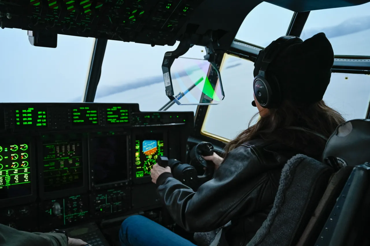 Here's Kristi driving a plane no less